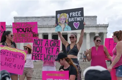  ?? AP ?? NOT A SLAVE FOR YOU: Fans and supporters of pop star Britney Spears, at left, protest at the Lincoln Memorial during a ‘Free Britney’ rally Wednesday in Washington.