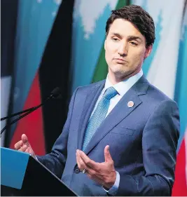  ?? LARS HAGBERG/AFP PHOTO/GETTY IMAGES ?? Prime Minister Justin Trudeau meets the media at the end of the G7 summit Saturday, where he warned President Trump that Canada wouldn’t back down under threats.