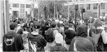  ?? RYAN GILLESPIE/ORLANDO SENTINEL ?? Protesters gather in the rain Thursday at Orlando City Hall after the broadcast of George Floyd’s first memorial service from Minneapoli­s.