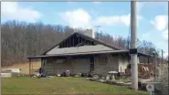  ?? DAVID MEKEEL — READING EAGLE ?? The aftermath of a house fire Friday night at 371 Rock Hollow Road, Robeson Township.