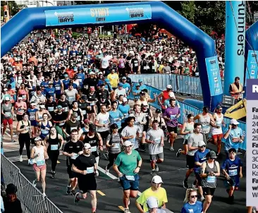  ?? LAWRENCE SMITH/ STUFF ?? More than 20,000 people created took part in New Zealand’s largest fun run – the Southern Cross Round the Bays.