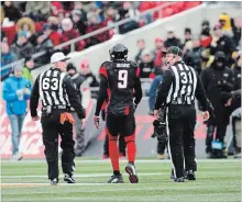  ?? SEAN KILPATRICK THE CANADIAN PRESS ?? Ottawa Redblacks’ Jonathan Rose is escorted off the field by officials after an incident on the sideline during the East final Sunday.