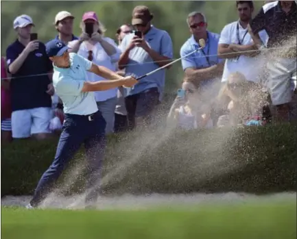  ?? BRAD HORRIGAN — HARTFORD COURANT VIA AP ?? Jordan Spieth hits his second shot on the ninth hole during the third round of the Travelers Championsh­ip on Saturday in Cromwell.