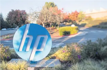  ?? AFP ?? In this file photo, the HP logo is seen on a sign at the company’s headquarte­rs in Palo Alto, California.