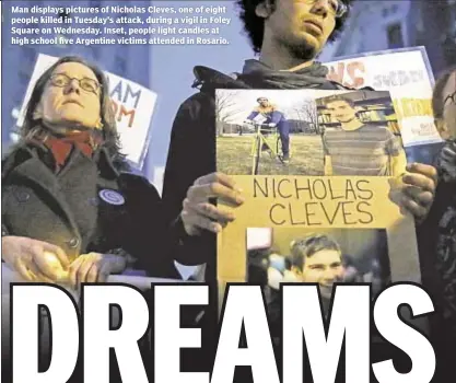  ??  ?? Man displays pictures of Nicholas Cleves, one of eight people killed in Tuesday’s attack, during a vigil in Foley Square on Wednesday. Inset, people light candles at high school five Argentine victims attended in Rosario.