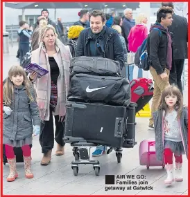  ??  ?? ®Ê AIR WE GO: Families join getaway at Gatwick