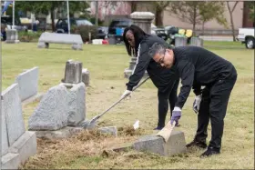  ?? PHOTO BY SANDI YANISKO — THE HILL SCHOOL ?? Volunteers help clean up the grounds at Edgewood Cemetery in Pottstown.