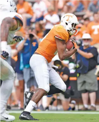  ?? STAFF PHOTO BY ROBIN RUDD ?? Tennessee receiver Jauan Jennings heads to the end zone for a touchdown early in the fourth quarter of Saturday’s game in Knoxville.