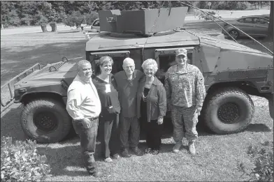  ?? Contribute­d Photo ?? Operation Appreciati­on: People stand in front of a military vehicle during the Operation Appreciati­on event. The event is geared towards honoring veterans who receive care through Life Touch services.