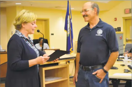  ?? Leslie Hutchison / Hearst Connecticu­t Media / ?? Drakeville Volunteer Fire Department Chief Mike Maccalous was recognized on Wednesday at City Hall by Mayor Elinor Carbone for his 50 years of service.
