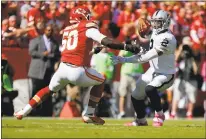  ?? KYLE RIVAS — GETTY IMAGES ?? Terrelle Pryor, right, tries to elude the Chiefs’ Justin Houston in the game that began the Raiders’ hard-luck streak in Kansas City. Oct. 13, 2013 Chiefs 24, Raiders 7