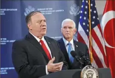  ?? Stringer/Getty Images ?? U.S. Secretary of State Mike Pompeo, left, and U.S. Vice President Mike Pence speak about a cease-fire in Syria during a news conference Thursday at the U.S. Embassy in Ankara, Turkey.