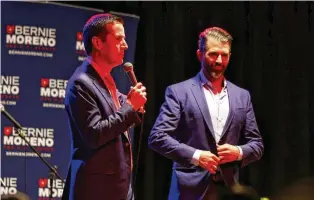  ?? NICK GRAHAM/STAFF ?? Bernie Moreno, Republican candidate for U.S. Senate (left) speaks to a crowd with Donald Trump Jr. beside him during a rally Wednesday at Lori’s Roadhouse in West Chester Twp.