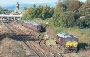  ?? JOHN CUMMING ?? GBRf’s Royal Scotsman-liveried No. 66746 runs round the stock of the luxury train in the up loop at Perth on the afternoon of October 12. The train had earlier run from Boat of Garten to Dunkeld (dropping passengers off for a tour of Glamis Castle) and in the evening would depart for Dundee.