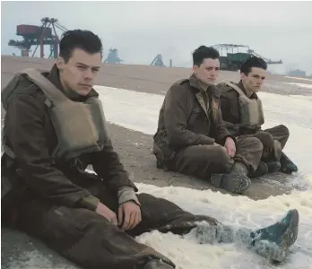  ??  ?? WAITING FOR RESCUE: Harry Styles, Aneurin Barnard and Fionn Whitehead, from left, play British soldiers trapped by advancing Germans during World War II in ‘Dunkirk.’