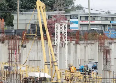  ?? ADRIAN LAM, TIMES COLONIST ?? Work crews started assembling a constructi­on crane at Colwood Corners. The developmen­t will eventually be a complete community with 471 residentia­l units and significan­t commercial space to be built out over five to seven years.