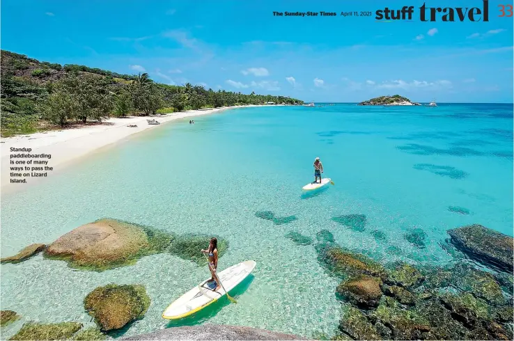  ??  ?? Standup paddleboar­ding is one of many ways to pass the time on Lizard Island.