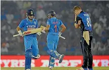  ??  ?? Jimmy Neesham sums up New Zealand’s frustratio­n as India’s Virat Kohli, left, rumbles on towards 154 not out.