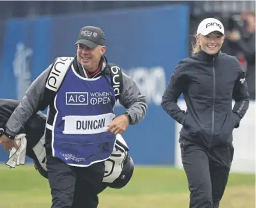  ?? ?? Dean Robertson caddying for Louise Duncan during the 2022 AIG Women’s Open at Muirfield