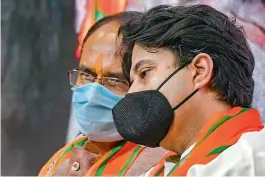  ?? — PTI ?? BJP Member of Parliament Jyotiradit­ya Scindia with Madhya Pradesh Chief Minister Shivraj Singh Chouhan during a welcome ceremony for Congress workers in the BJP, at state party headquarte­rs in Bhopal on Thursday.