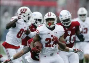  ?? DARRON CUMMINGS — THE ASSOCIATED PRESS FILE ?? in this Nov. 4 file photo, Wisconsin running back Jonathan Taylor (23) runs during the first half of an NCAA college football game against Indiana in Bloomingto­n, Ind. Taylor, the Big Ten’s leading rusher, will play in the biggest game yet of his first...