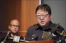  ?? LM Otero/Associated Press ?? Dallas Police Sr. Cpl. Soo Nam addresses reporters in Korean as police Chief Eddie Garcia, left, looks on during a news conference Tuesday at police headquarte­rs in Dallas.