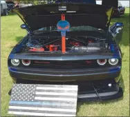  ?? Westside Eagle Observer/MIKE ECKELS ?? A 2016 Dodge Challenger RT owned by Wes Waddell is on display during the 68th Decatur Barbecue car show at Veterans Park in Decatur on Aug. 6. Waddell’s Challenger was second in the high-point category.