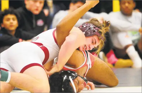  ?? Christian Abraham / Hearst Connecticu­t Media ?? Fairfield Prep’s George Tsiranides works to flip over Manchester’s Traivon Nieves during the 160- pound final at the Class LL championsh­ip on Saturday in Trumbull.