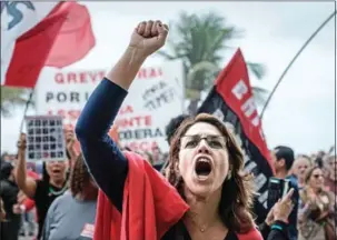  ?? YASUYOSHI CHIBA/AFP ?? A demonstrat­or shouts slogans during a protest against President Michel Temer in Rio de Janeiro on Sunday.