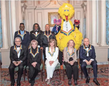  ?? RON SACHS/POOL/ EPA-EFE ?? 2019 Kennedy Center Honorees on Dec. 7. From left to right, back row, Philip Bailey, Verdine White, Ralph Johnson, Abby, Big Bird and Elmo; front row, Michael Tilson Thomas, Linda Ronstadt, Sally Field and “Sesame Street” co-creators Joan Ganz Cooney and Dr. Lloyd Morrisett.