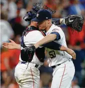  ?? Godofredo A. Vasquez / Houston Chronicle ?? That’s a wrap! Catcher Max Stassi congratula­tes Ken Giles on his first three-out save of the season, which helped the Astros avert an Angels sweep.