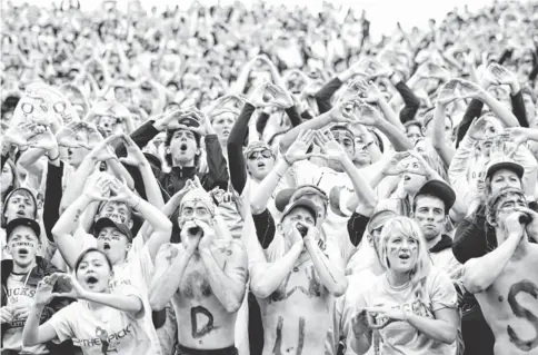  ?? JOE NICHOLSON, USA TODAY SPORTS ?? Oregon fans cheer their team Nov. 6, 2010. Some experts say attempts to lure fans are an overreacti­on to a small decline in attendance.