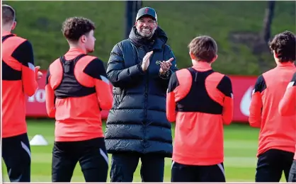  ?? GETTY IMAGES ?? Jurgen the cheerleade­r: manager Klopp encourages his players in training