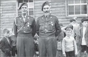  ??  ?? 1964 FCA in New Ross: Capt Dick O’Grady and Comdt Andy Minihan at Capt O’Grady’s retirement. Both officers wearing Emer LDF (Local Defence Forces) medals 1939-46. B.Coy 10th Infantry Batallion FCA at the Training Centre in Mahers Yard, New Ross.