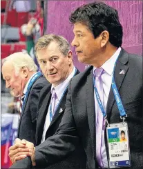  ?? IIHF/TWITTER/FILE ?? In this file photo from the 2014 Winter Olympic Games in Sochi, Russia, Latvian assistant coach Tom Coolen (centre) is shown on the bench with head coach Ted Nolan (right). After two years coaching the CWSHL’S Grand Falls-windsor Cataracts, Coolen has...