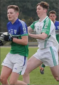  ??  ?? Jamie O’Shea of Glynn-Barntown is chased by Daniel Sunderland (Naomh Eanna) in their JFC tie on Sunday.