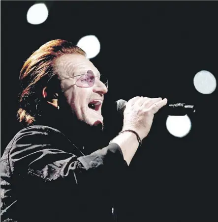  ?? Gary Coronado Los Angeles Times ?? THROWBACK TUESDAY: Bono has a few things to say at the Forum in a concert that saw U2 turn inward, back to earlier times.