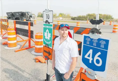  ?? MICHAEL BELL ?? Jesse Edwards stands at the now-closed intersecti­on of Main Street and the Trans-Canada Highway in Balgonie. Edwards, a volunteer firefighte­r, is concerned about safety and response times for emergency responders due to the recent change at the...