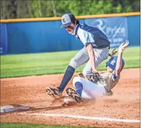  ?? Courtney Couey, Ringgold Tiger Shots ?? Gordon Lee’s Aiden Goodwin hustles to apply a tag to a sliding Brayden Sylar during the Trojans’ game at Ringgold last week. The Tigers would pick up a narrow 4-3 victory.