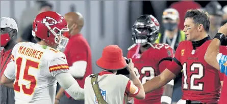  ?? AP FILE ?? Tampa Bay Buccaneers quarterbac­k Tom Brady, right, congratula­tes Kansas City Chiefs quarterbac­k Patrick Mahomes after their NFL football game Nov. 29, 2020, in Tampa, Fla., which the Chiefs won over the Bucs, 27-24.