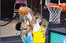  ??  ?? Houston Rockets center Christian Wood (35) tries to shoot around Los Angeles Lakers forward Anthony Davis (3) during an NBA basketball game,
Jan 12, in Houston. (AP)