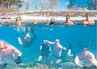  ?? STEVE MANN PHOTO ?? This composite photo shows swimmers above and below the water at the pebble beach at Ontario Place during the winter months. The Therme Spa plan would move the beach to a location prone to trapping garbage and the overflow of sewage, writes Steve Mann.