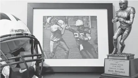  ?? JEFFREY T. BARNES/ USA TODAY SPORTS ?? Mementos from Matthew Benedict’s football career are on display at the home of Anne and Bill Benedict.