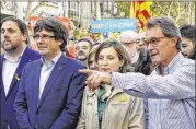  ?? MANU FERNANDEZ / ASSOCIATED PRESS ?? Former Catalan President Artur Mas gestures next to Catalan Deputy President Oriol Junqueras (from left), President Carles Puigdemont and parliament speaker Carme Forcadell during a protest Saturday of the National Court’s decision to imprison civil...