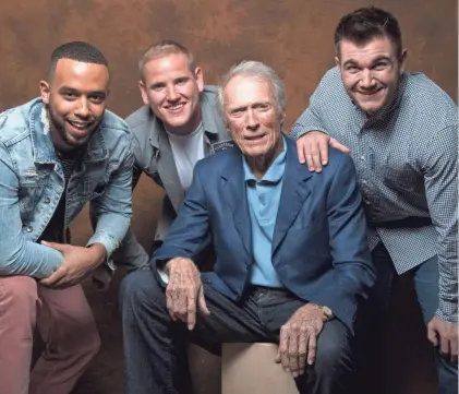  ??  ?? Director Clint Eastwood, center, found real-life heroes Anthony Sadler, left, Spencer Stone and Alek Skarlatos were the best people to star in “The 15:17 to Paris.” ROBERT HANASHIRO/USA TODAY