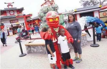  ??  ?? New adventure ... Lego Ninjago: The Ride has thrilled Legoland visitors in Billund, Denmark and California, US (left and bottom) and has now made its way to the brand new Ninjago World in Legoland Malaysia Resort.