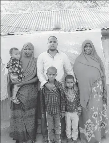  ?? CONTRIBUTE­D ?? The Iye family, pictured in front of their home inside the Dadaab Refugee Camp, consists of, from left, “Zaki,” age one, Nimo, Ibrahim, five-year-old Maryan, Zuheyb and seven-year-old Farhan.