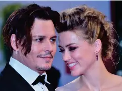  ?? (AFP/Getty) ?? Johnny Depp with ex-wife Amber Heard in September 2015