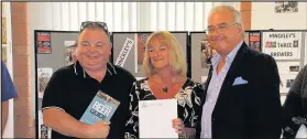  ??  ?? John and Sue Summerill from The Pestle and Mortar in Hinckley received a certificat­e from Camra chief executive Tim Page, right, at the tenth Hinckley Beer Festival to mark their pub’s inclusion in the 2018 Good Beer Guide. Picture: Graham Lancaster