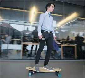  ?? PETER McCABE PHOTOS: ?? Nicolas Roy rides the halls of John Abbott College on a motorized longboard he designed in the engineerin­g technologi­es course.